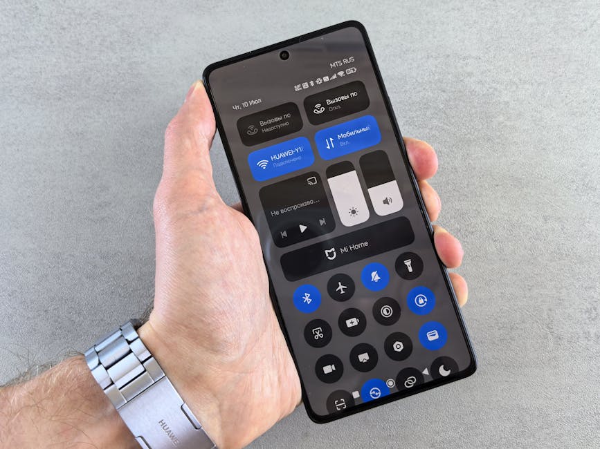 Person using a smartphone with a wireless Bluetooth audio headset