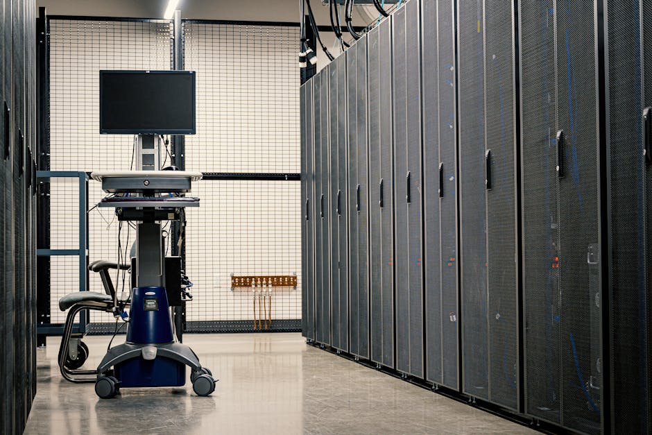 IT team reviewing security controls in a server room with network equipment