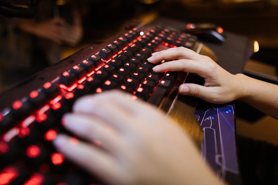 Competitive gamer typing on an optical keyboard during a fast-paced match