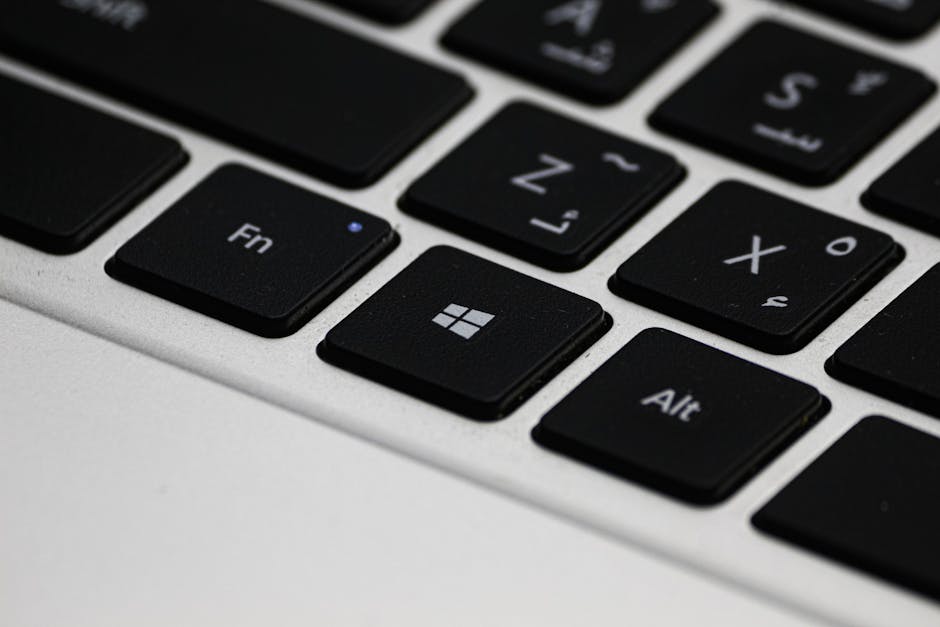 Laptop screen showing Windows Update activity, suggesting scheduled updates causing CPU load