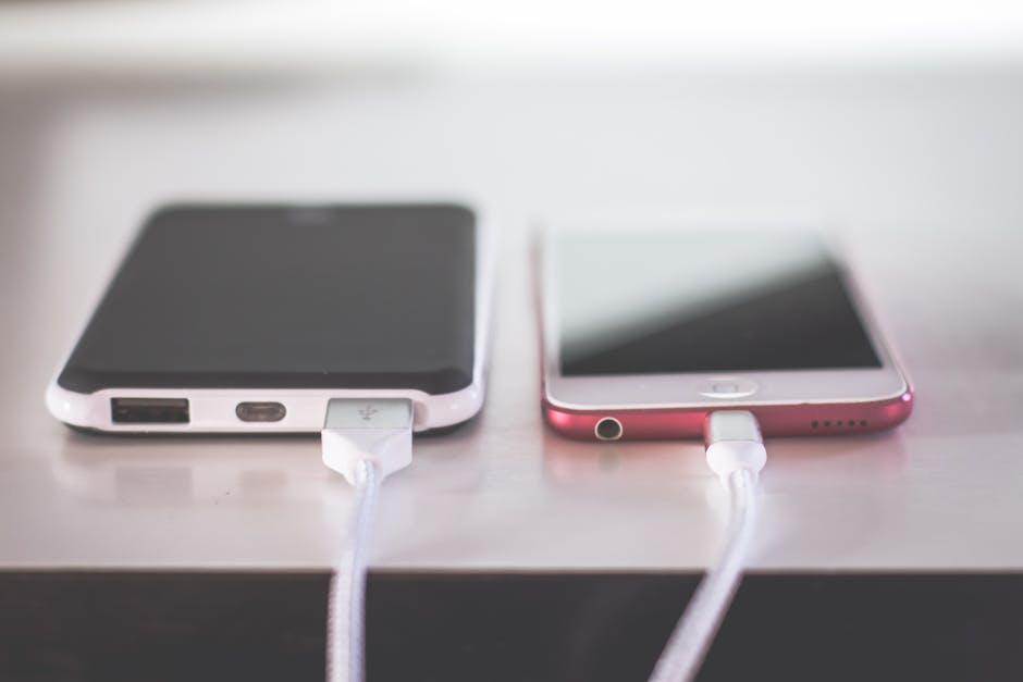 Close-up of a USB-C charger cable and adapter with a warm device suggesting heat risk