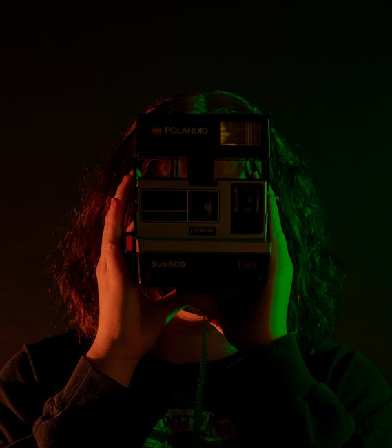 Person tapping to focus and taking a low-light portrait with a smartphone
