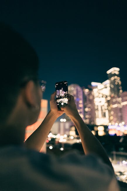 Smartphone filming a nighttime scene showing low-light camera detail factors