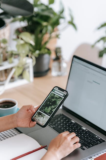People using a phone and laptop on Wi‑Fi while moving around for steadier downloads