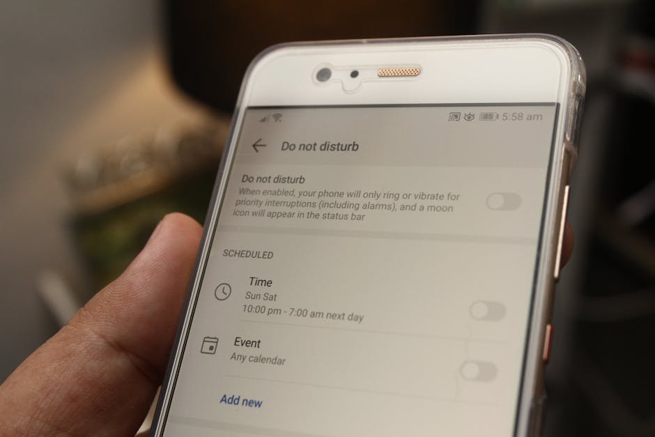 Person reviewing app permission toggles on a smartphone settings screen