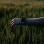 Close-up of a smartwatch displaying fitness data, “Smartwatch Roundup” icons, highlighting GPS, sensors, battery for 2026