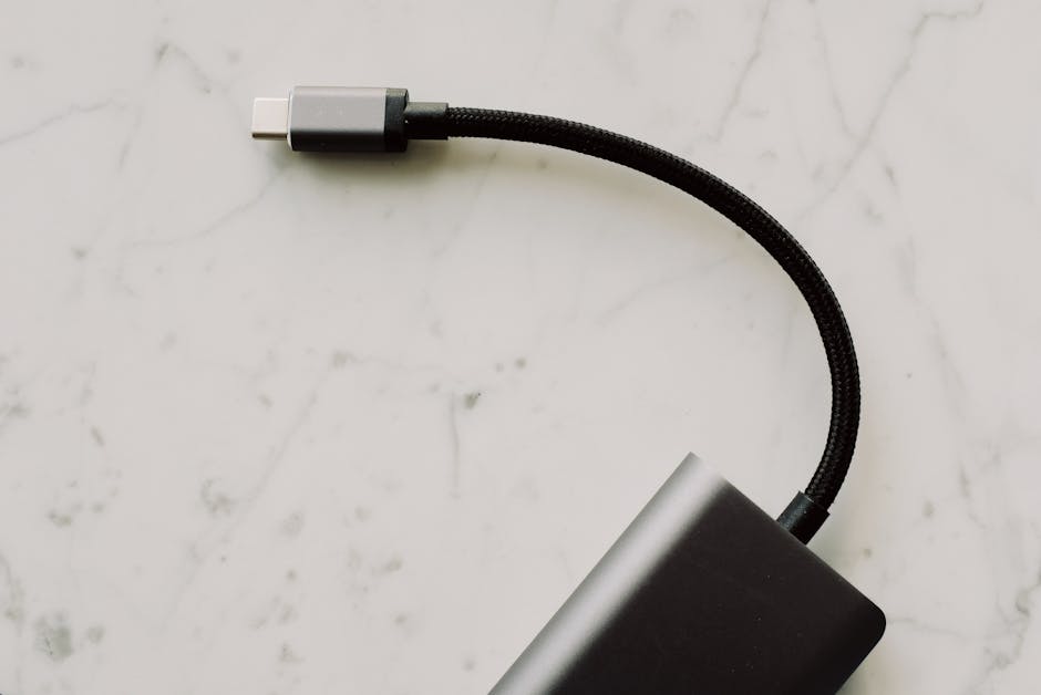 USB-C Explained: data speeds and charging limits shown on a smartphone with USB-C cable, compatibility tips.