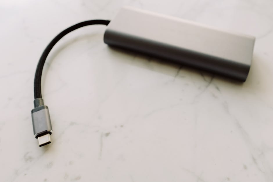 USB-C dock connected to a monitor with visible cables and laptop