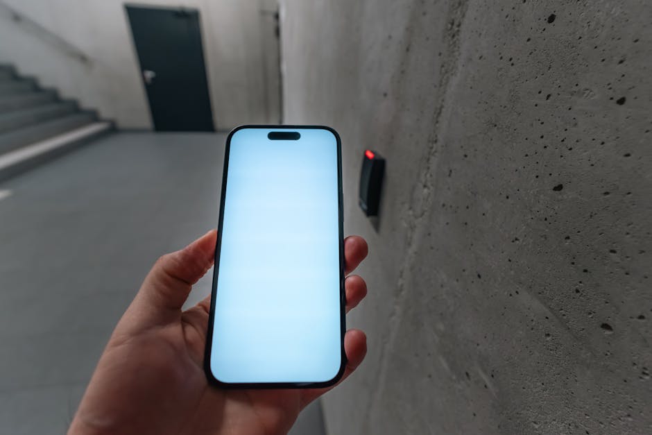 Person authenticating on a smartphone with a biometric prompt for passkey access