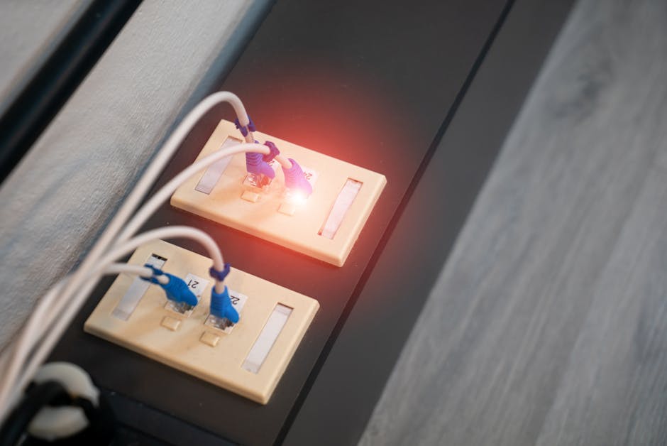 Close-up of a home router and modem while troubleshooting an internet upload issue