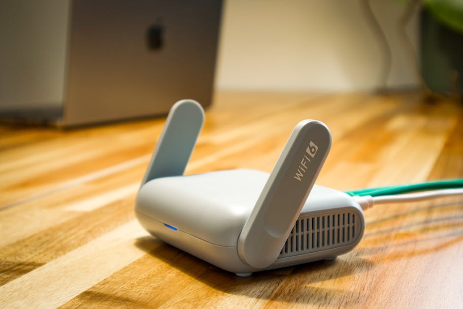 Home network router with laptop showing firmware and security settings