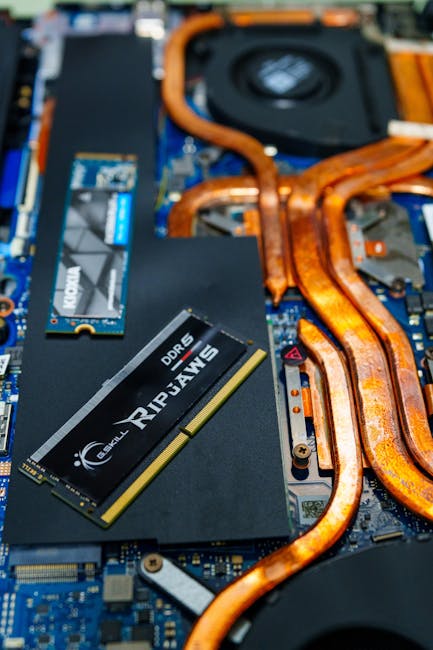 Laptop Buying Guide for 2026: person comparing CPU, RAM, SSD, and GPU settings on screen without overspending, Pexels