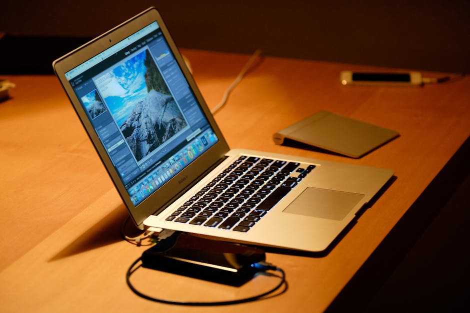 Laptop running diagnostics with fans and overheating indicators, showing sustained performance testing