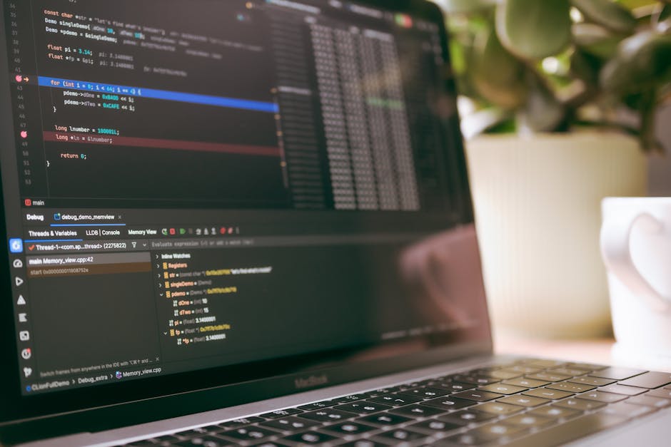 Person coding on a laptop at a desk, illustrating real dev workloads beyond benchmarks