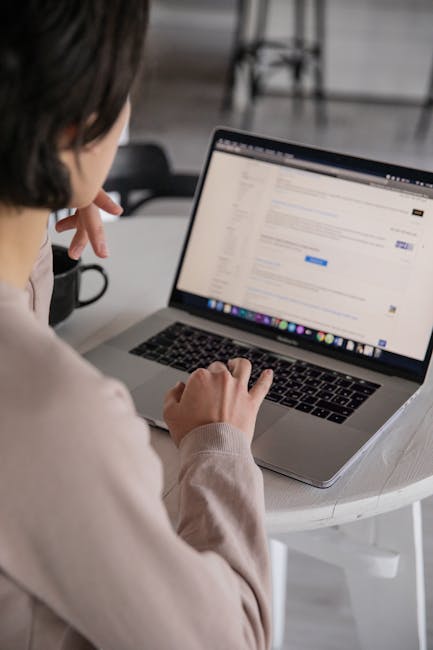 Person using a laptop with browser privacy protections to reduce cross-site tracking