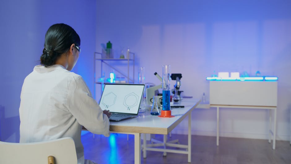 Close-up of a person testing AI features on a laptop during a battery vs plug-in check