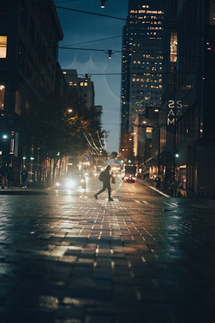 Person recording walking video at night with street lights, showing stabilization in motion