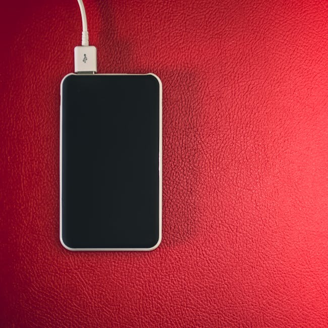 Phone charging with a cable, showing a warm device that may indicate PD throttling