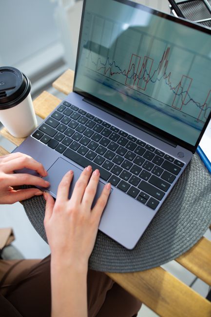 Person viewing network packet analysis details on a laptop screen