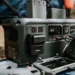 Gadget Review: Portable power station test showing charging, efficiency, and safety features in action, outdoors.