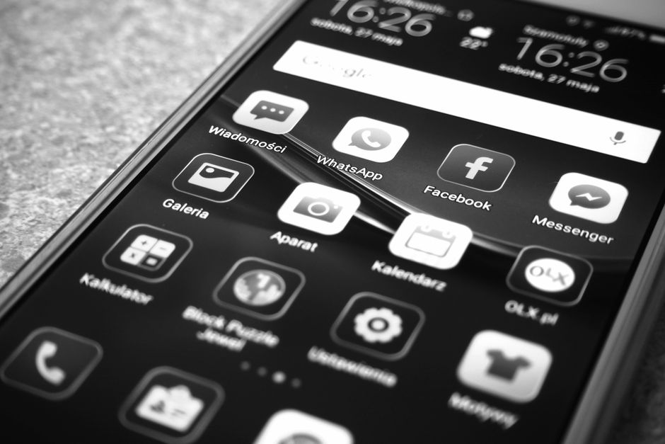 Person reviewing app permissions on a smartphone screen