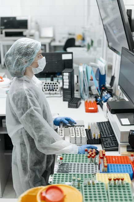 Healthcare researcher comparing wearable sensor data to medical reference monitoring devices